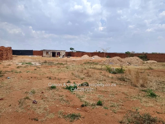 Walled 3800 m² Industrial Site in Chitungwiza — Gate & Gravel Access