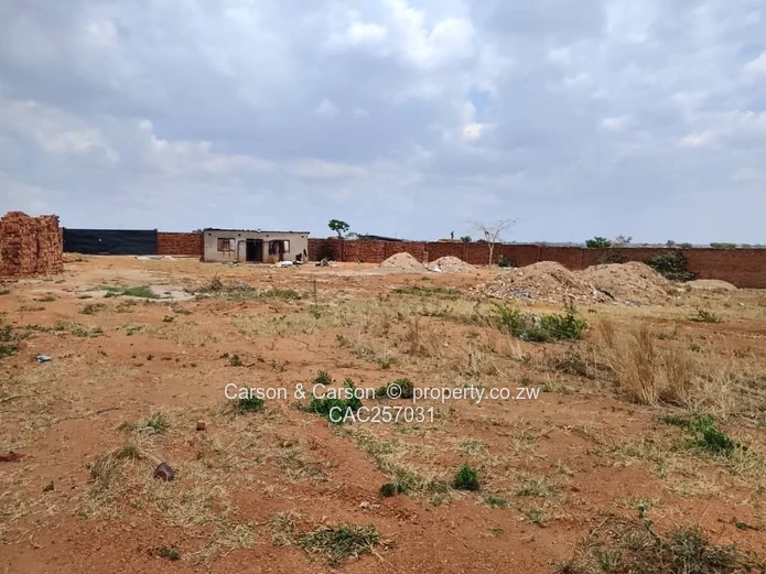 Walled 3800 m² Industrial Site in Chitungwiza — Gate & Gravel Access