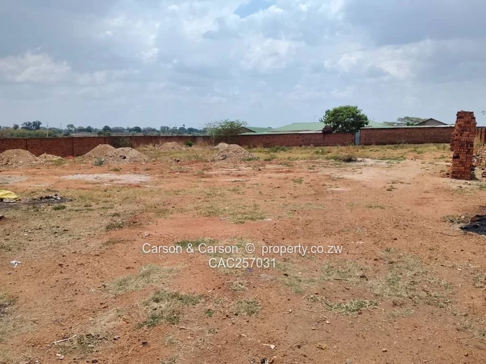 Walled 3800 m² Industrial Site in Chitungwiza — Gate & Gravel Access