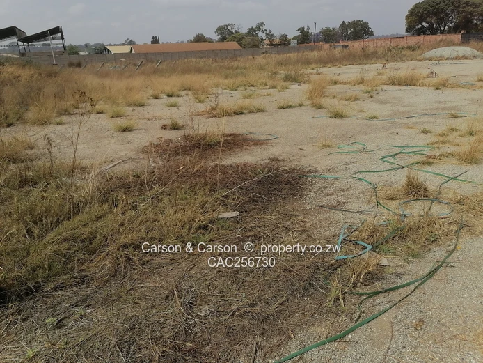 8001m² Walled Commercial Land — Main Road, Ardbennie, Harare South
