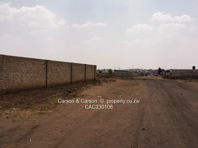Walled 2568m² Stand on Gravel Road — Chitungwiza (Sole Mandate)