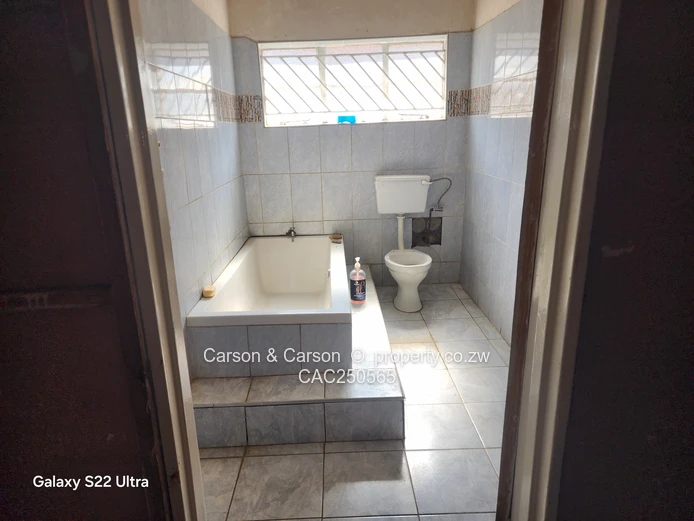Street-Facing Brick 4BR in Seke — Water Tank & Solar