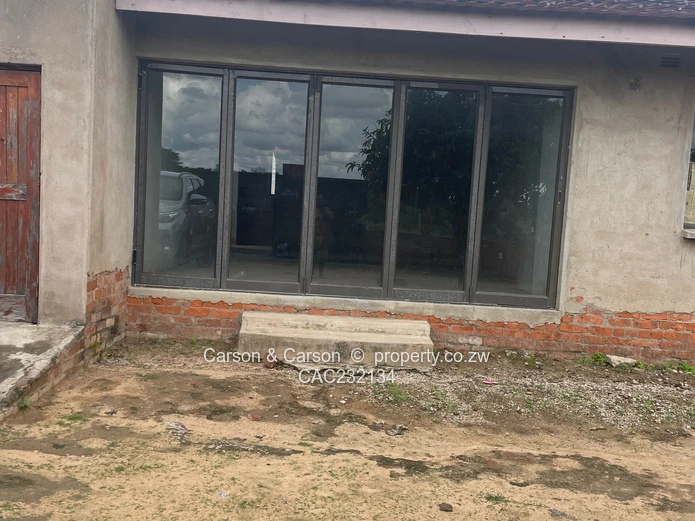 Walled 3-Bed Home with Verandah & Main Road Frontage