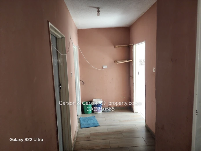 Street-Facing Brick 4BR in Seke — Water Tank & Solar