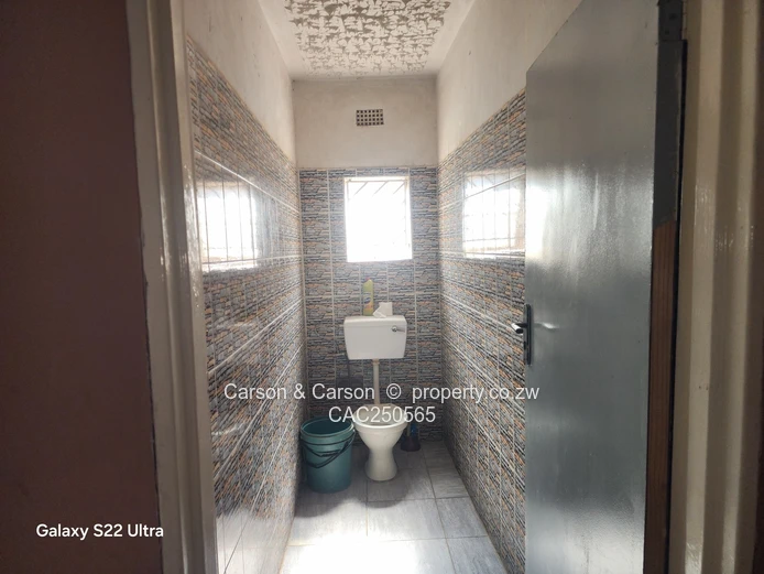 Street-Facing Brick 4BR in Seke — Water Tank & Solar