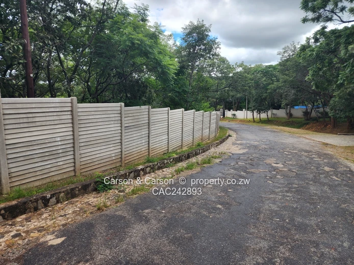 Chisipite 5500m² — Tree-Lined Stand with Tarred Main Road Frontage