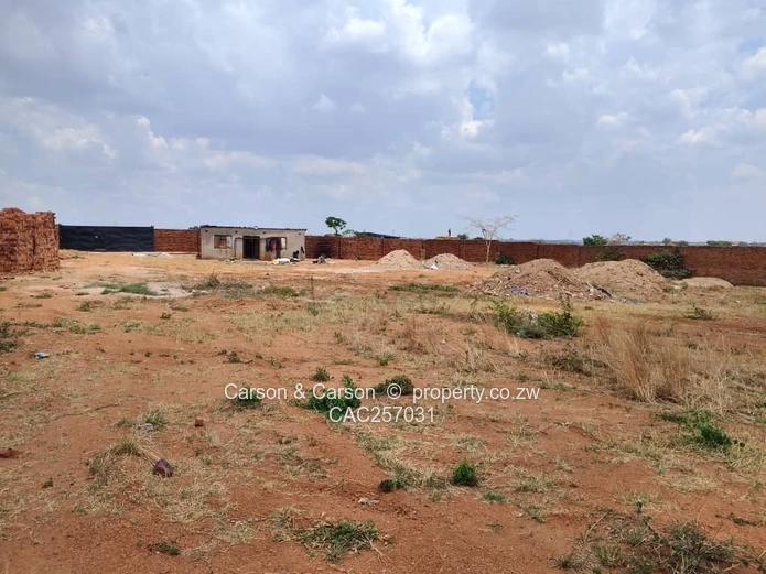 Walled 3800 m² Industrial Site in Chitungwiza — Gate & Gravel Access