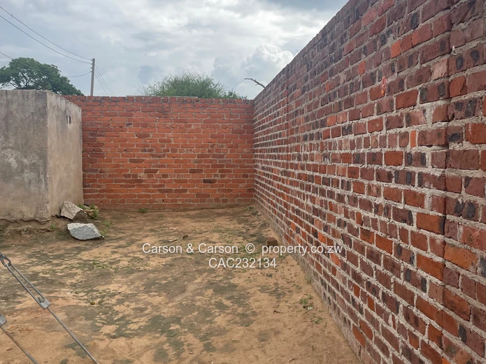 Walled 3-Bed Home with Verandah & Main Road Frontage